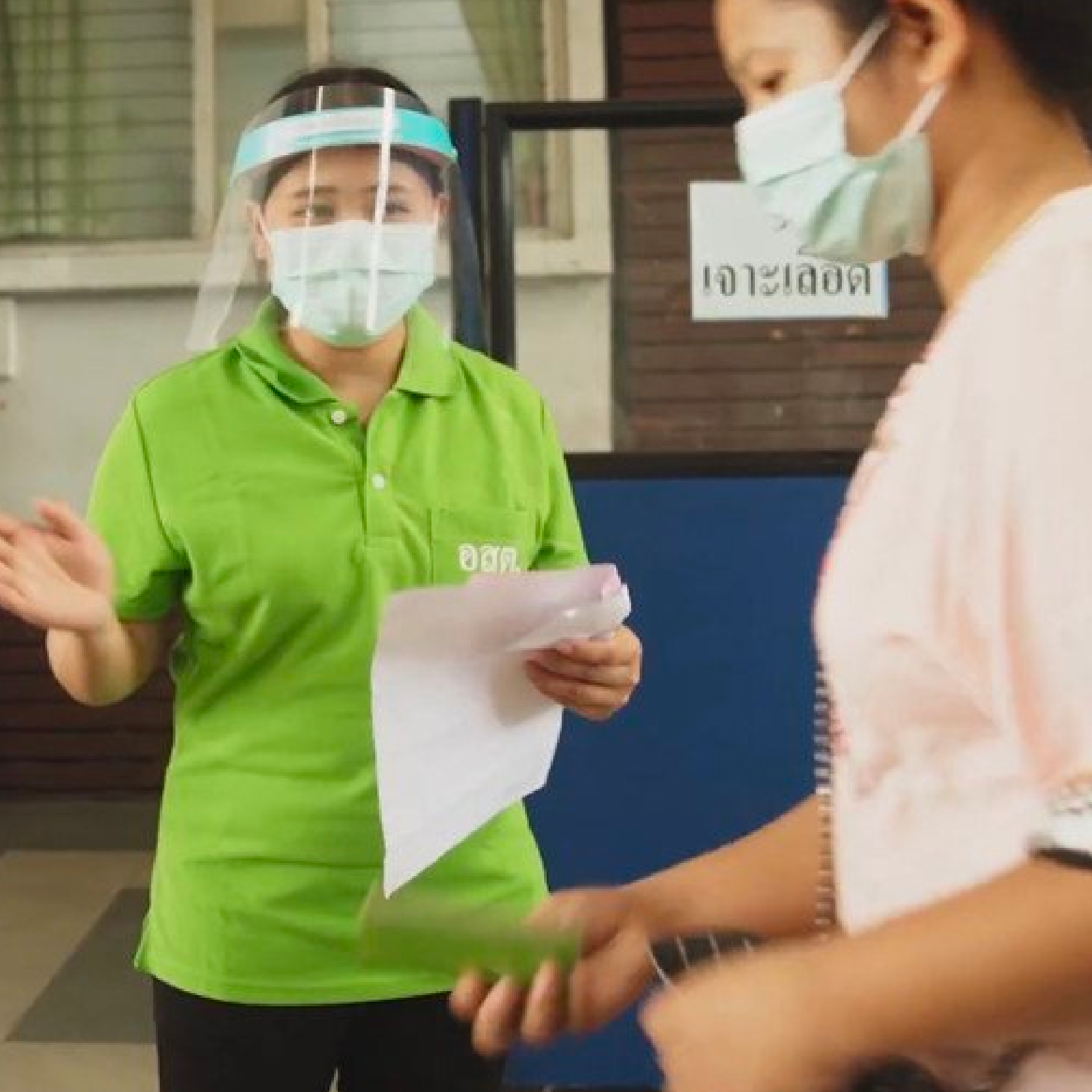 Lwin Lwin Kyi (left), a Burmese migrant health volunteer during COVID-19 response.