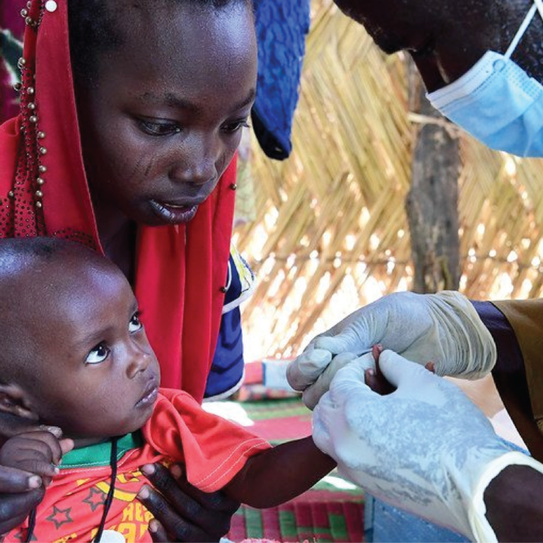 A baby is tested for malaria at a community health centre in Chad.