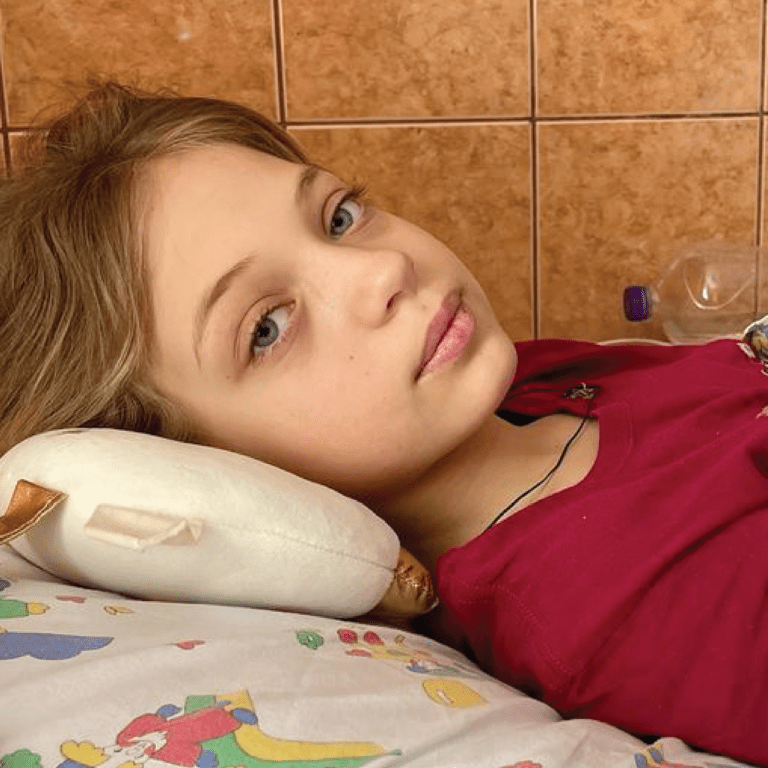 An eleven-year-old girl who lost both legs in the missile attack at Kramatorsk railway station recovers at Lviv hospital in Ukraine.