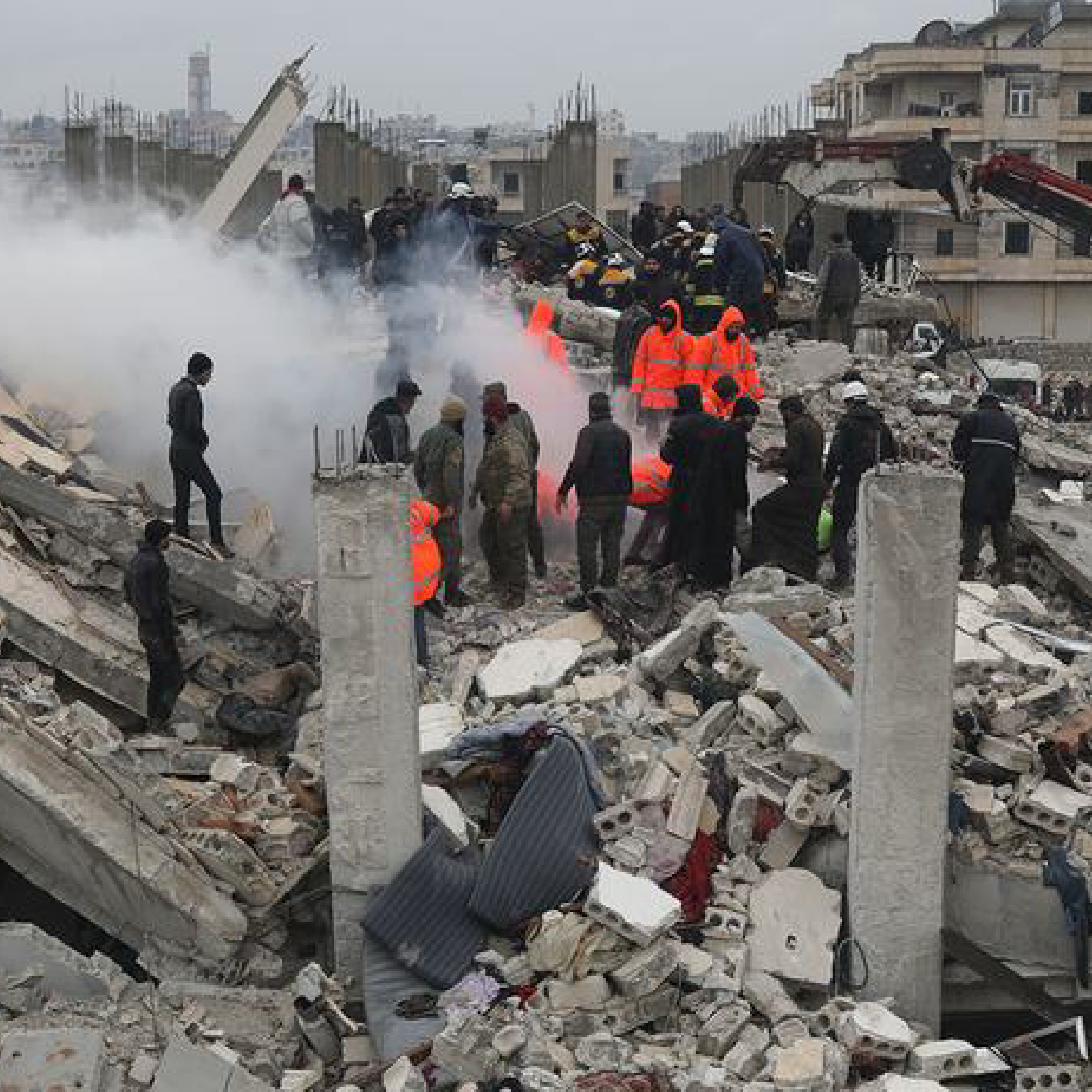 Rescue workers look for survivors in a building in Samada, Syria destroyed by the February 6 earthquake.