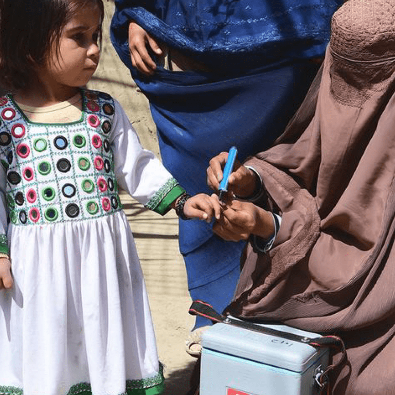 A child is vaccinated against polio during a polio mobilization campaign in Kandahar, Afghanistan.