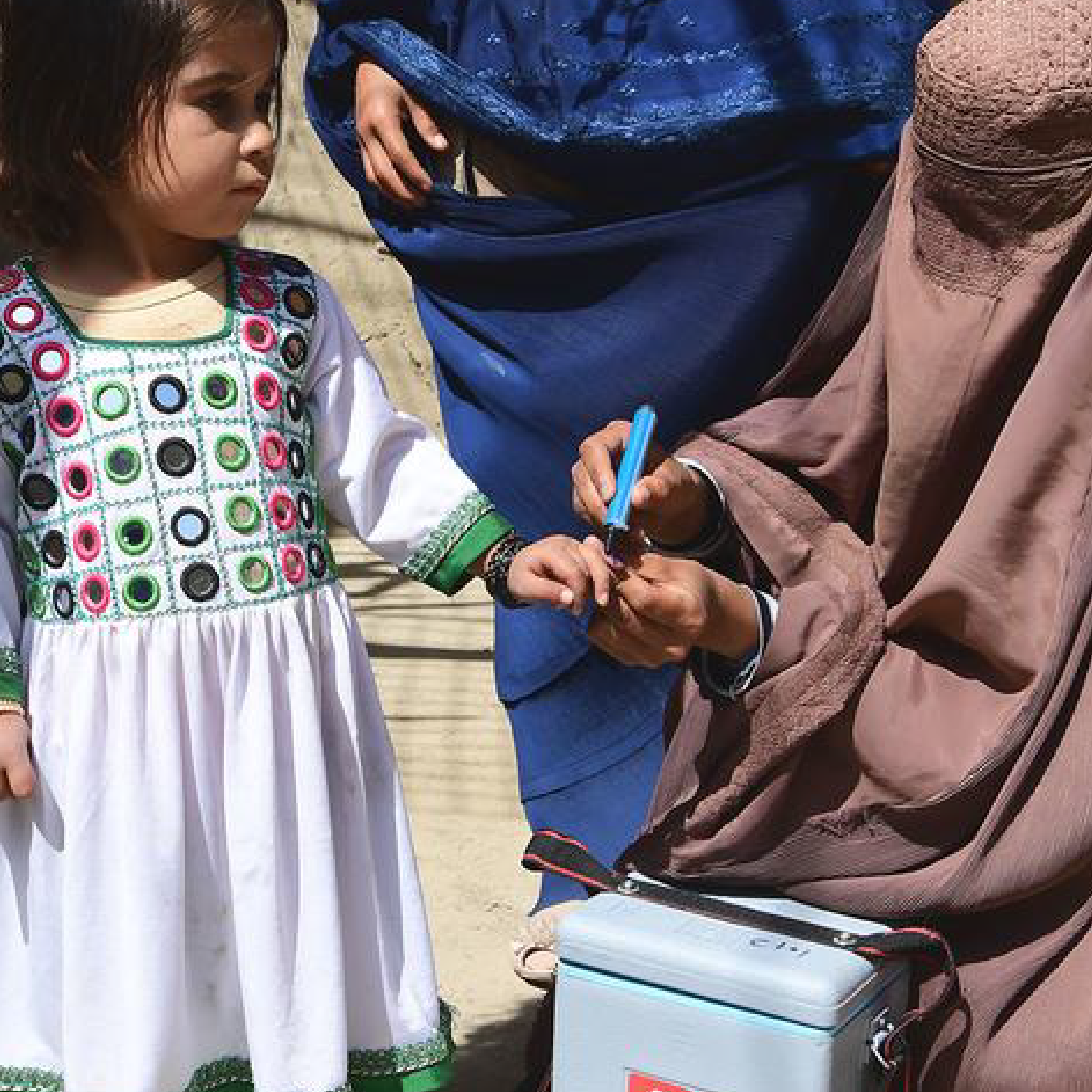 A child is vaccinated against polio during a polio mobilization campaign in Kandahar, Afghanistan.