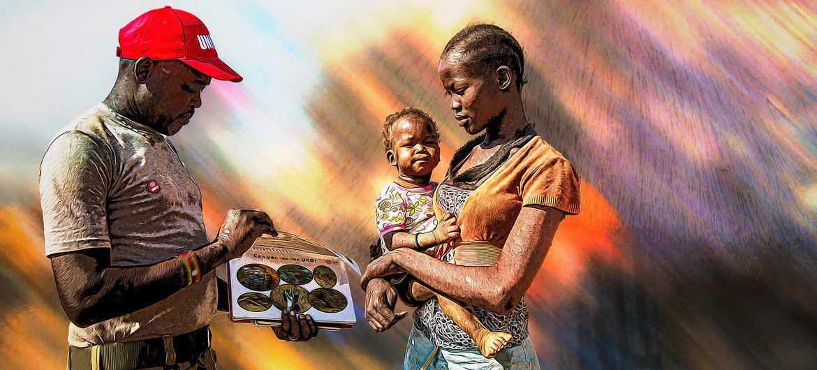  An UN Mine Action Service (UNMAS) community liaison officer, talks to a woman in South Sudan about the danger of mines.
