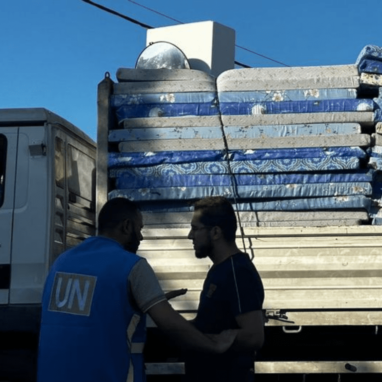 Mattresses are delivered by a UN truck in the south of Gaza.