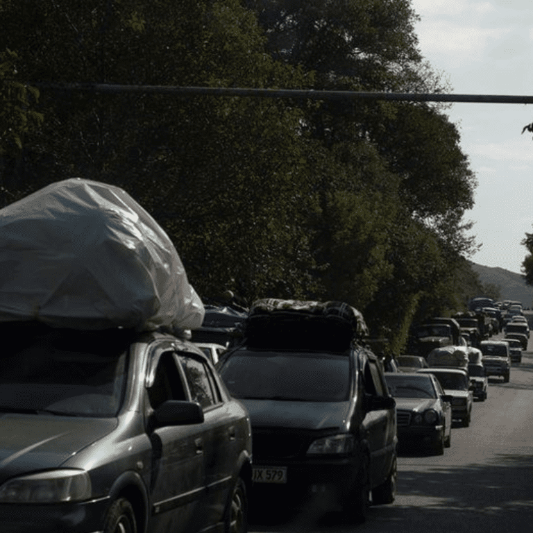 Refugees arrive in the border town of Goris in Armenia