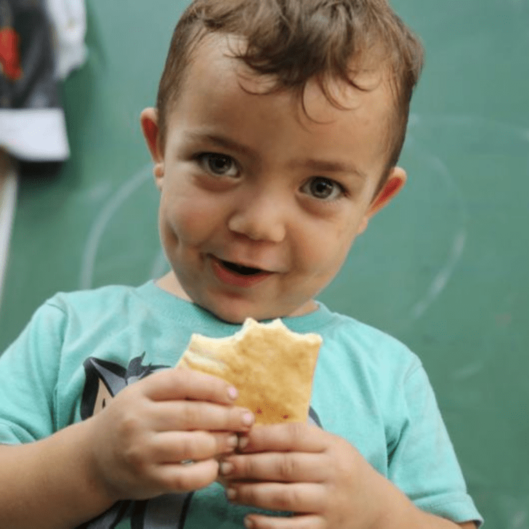 The UN's World Food Programme (WFP) distributed bread to families sheltering from ongoing violence in Gaza.