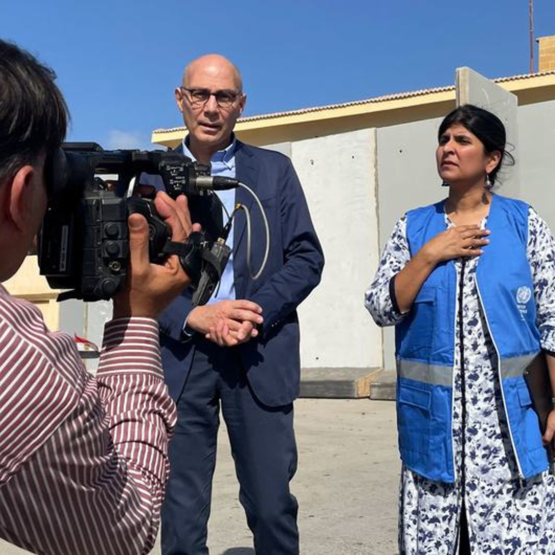 The UN human rights chief, Volker Türk, (left) stands outside the Rafah crossing point into Gaza with Spokesperson, Ravina Shamdasani.