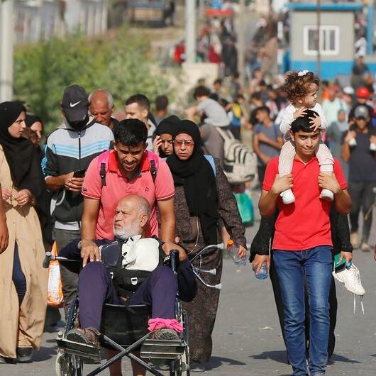 Palestinians flee northern Gaza.