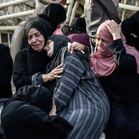 Palestinian women mourn the loss of a family member at Al-Nasser Medical Hospital in Khan Younis, southern Gaza