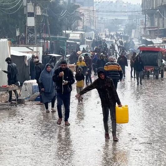 Displaced Palestinians at a temporary shelter in the Southern Gaza Strip city of Rafah